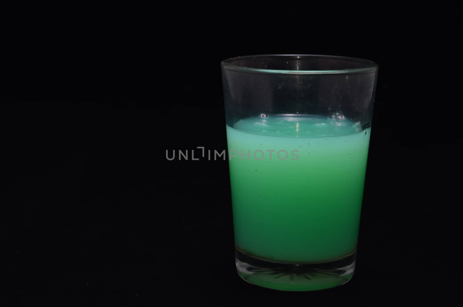 Green Liquid Glass on a Black Background