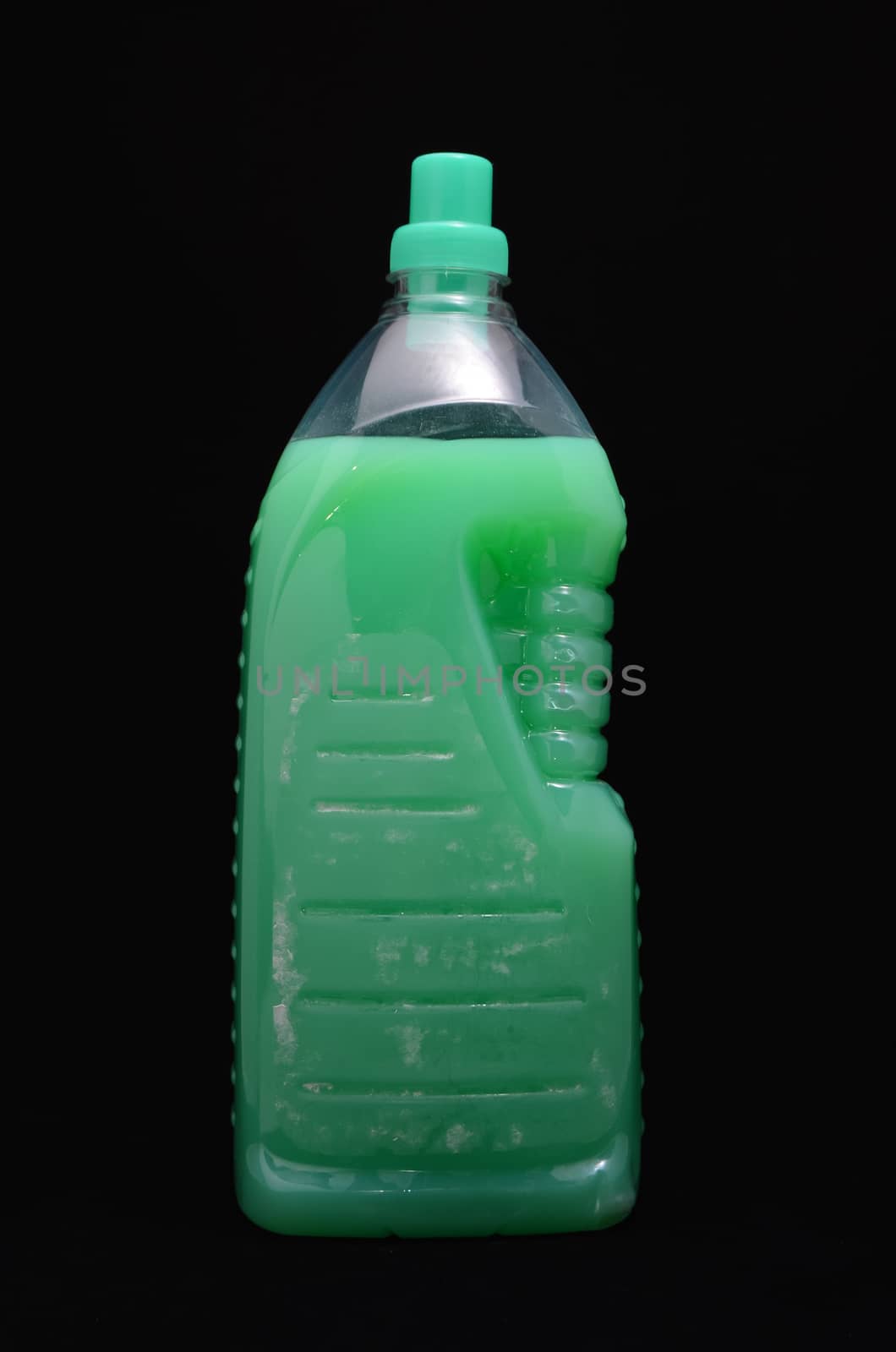 Plastic Green Detergent Bottle on a Black background