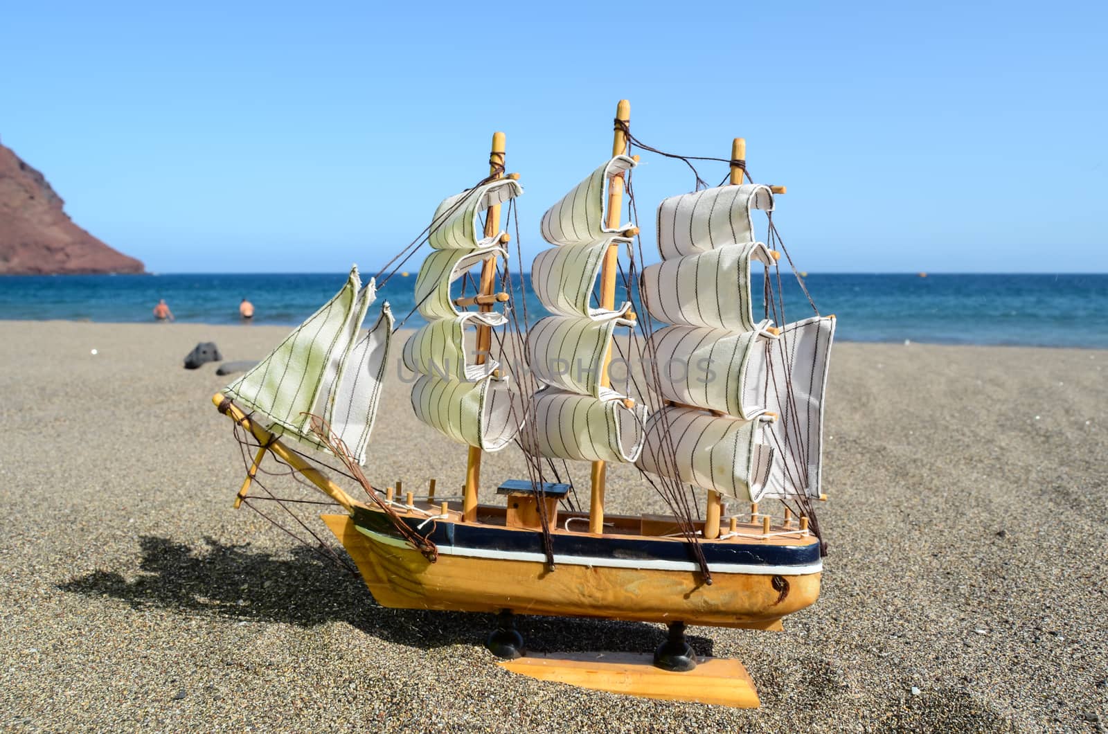Sail Ship Toy Model in the Beach Sand Close-up