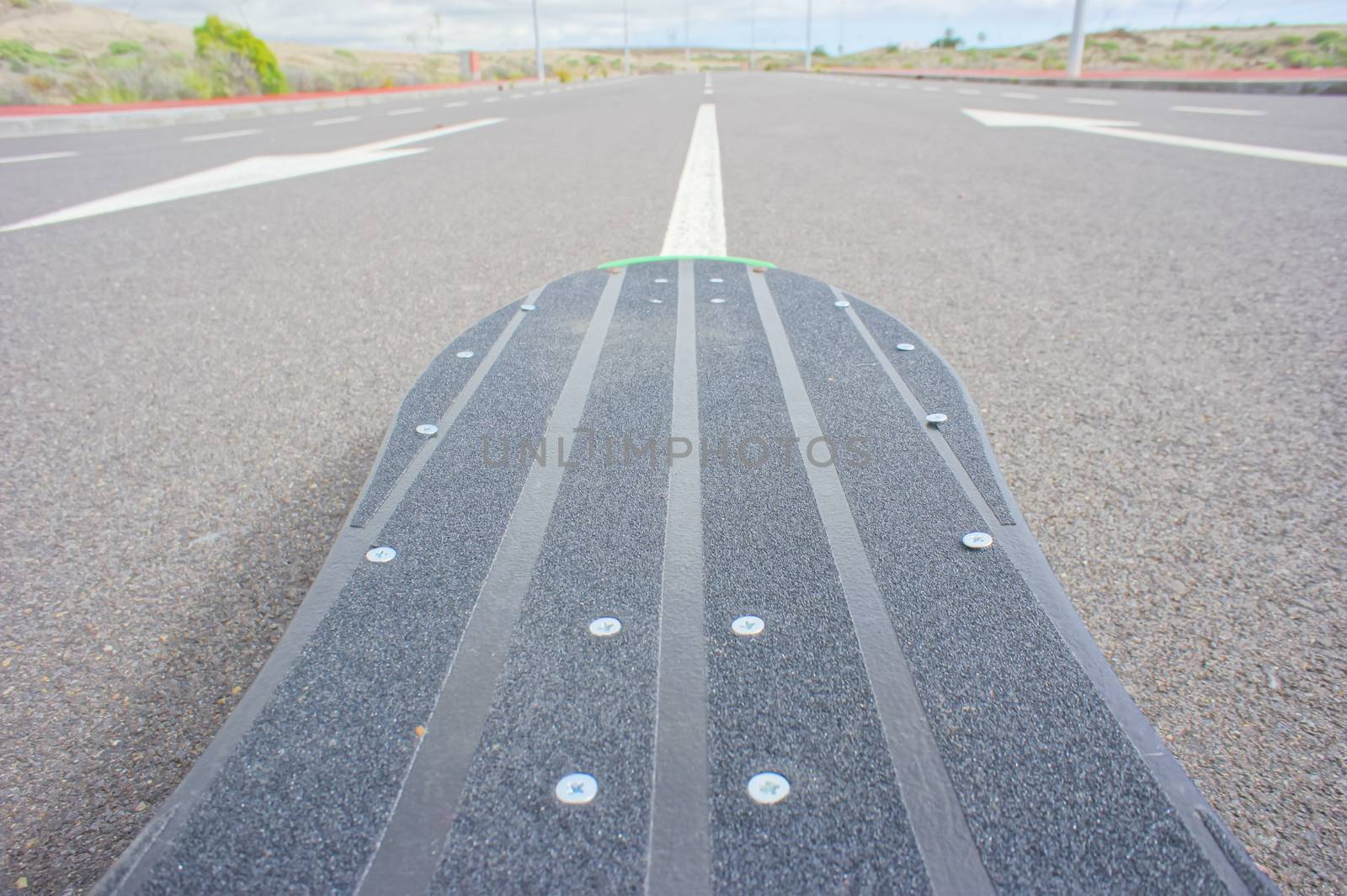 Hdr Picture Vintage Style Longboard Black Skateboard on an Empty Asphalt Desert Road