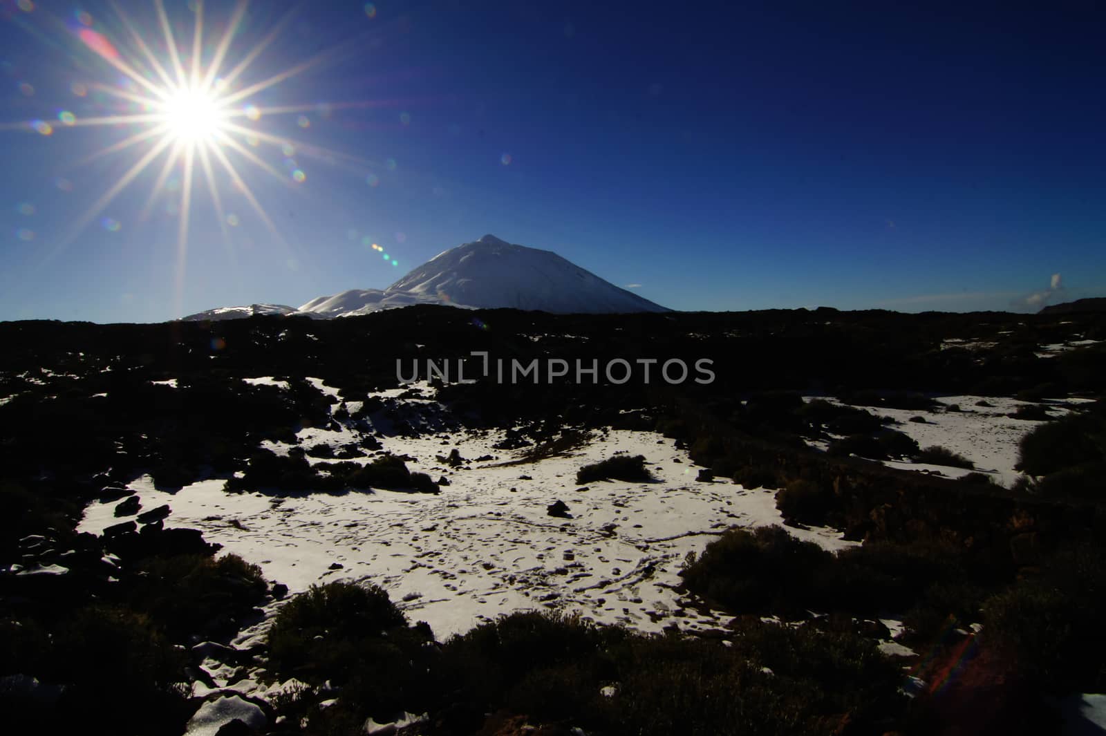 Backlight Sunbeams and Snow on Teide Tenerife Canary Islands