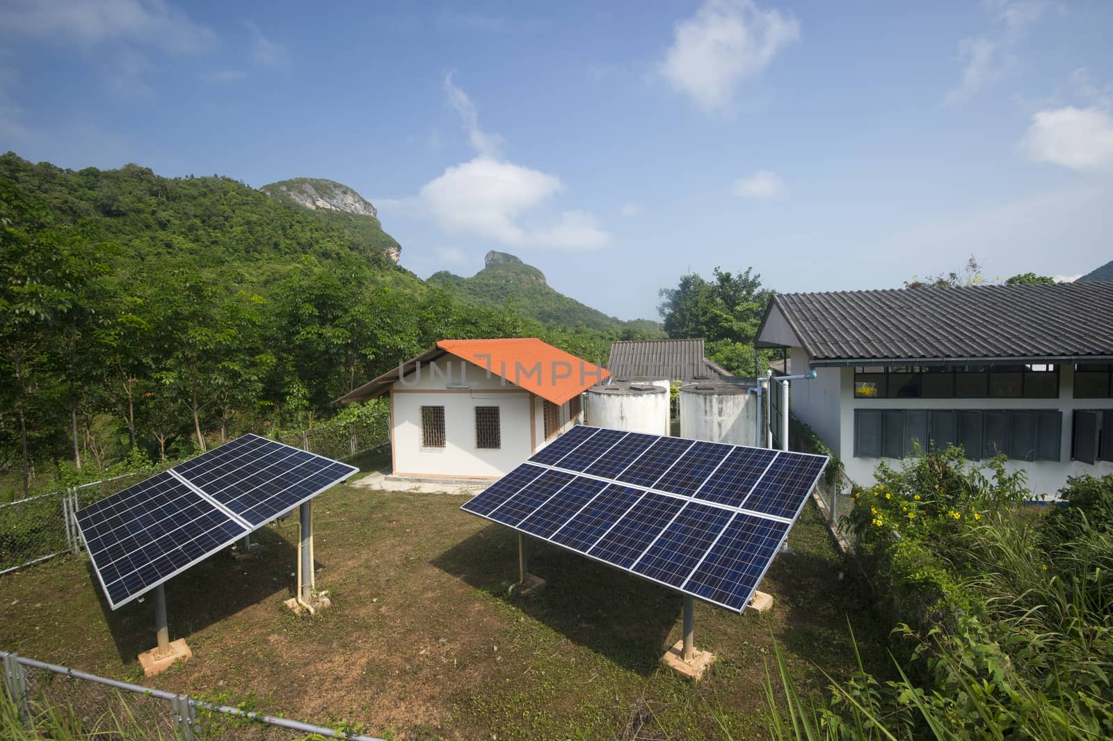 solar panel providing power to a rural area in thailand by think4photop