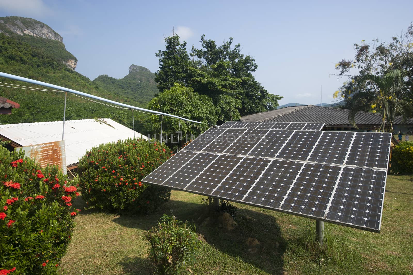 solar panel providing power to a rural area in thailand by think4photop