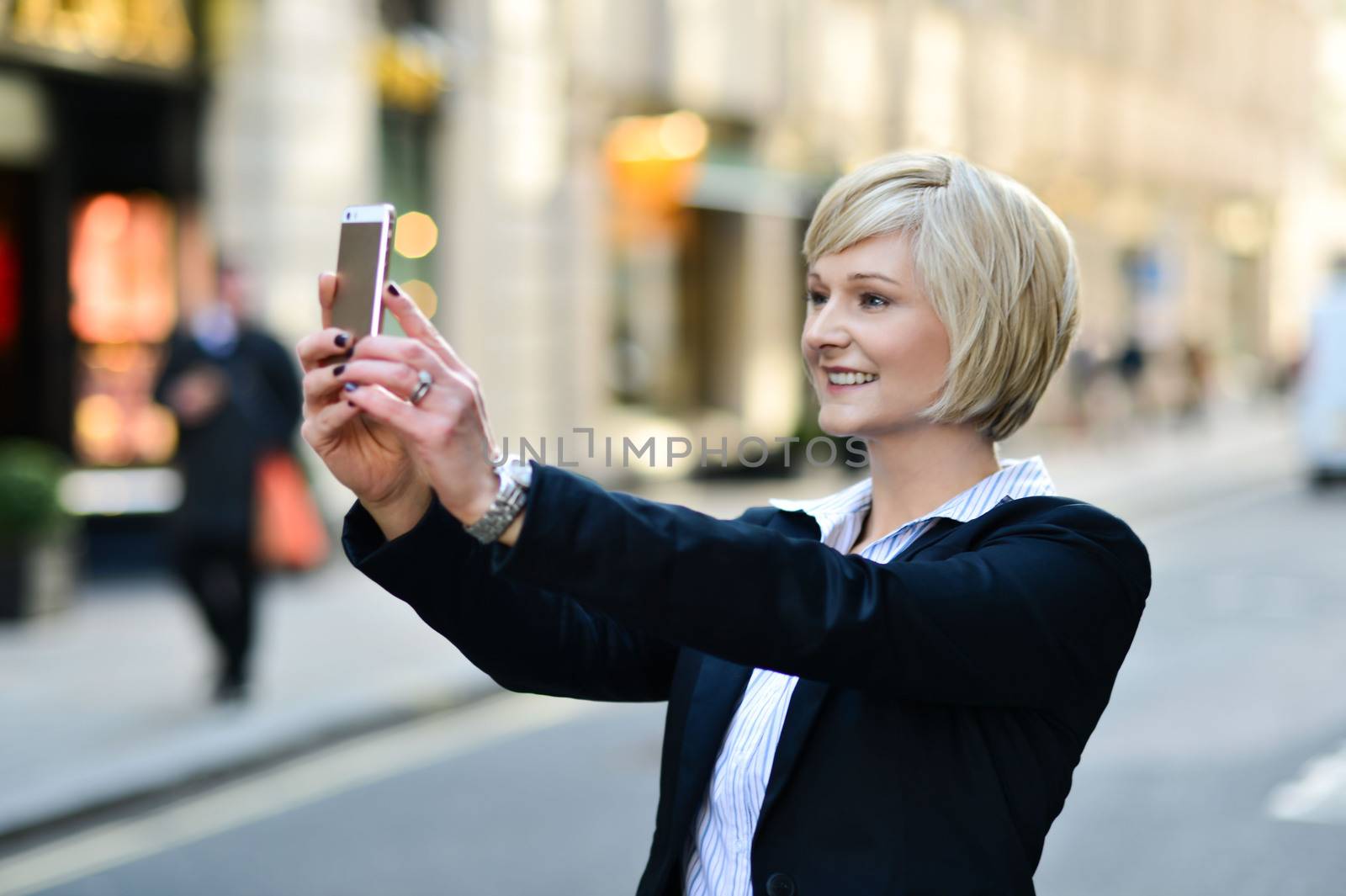 Corporate lady clicking her pic, outdoors