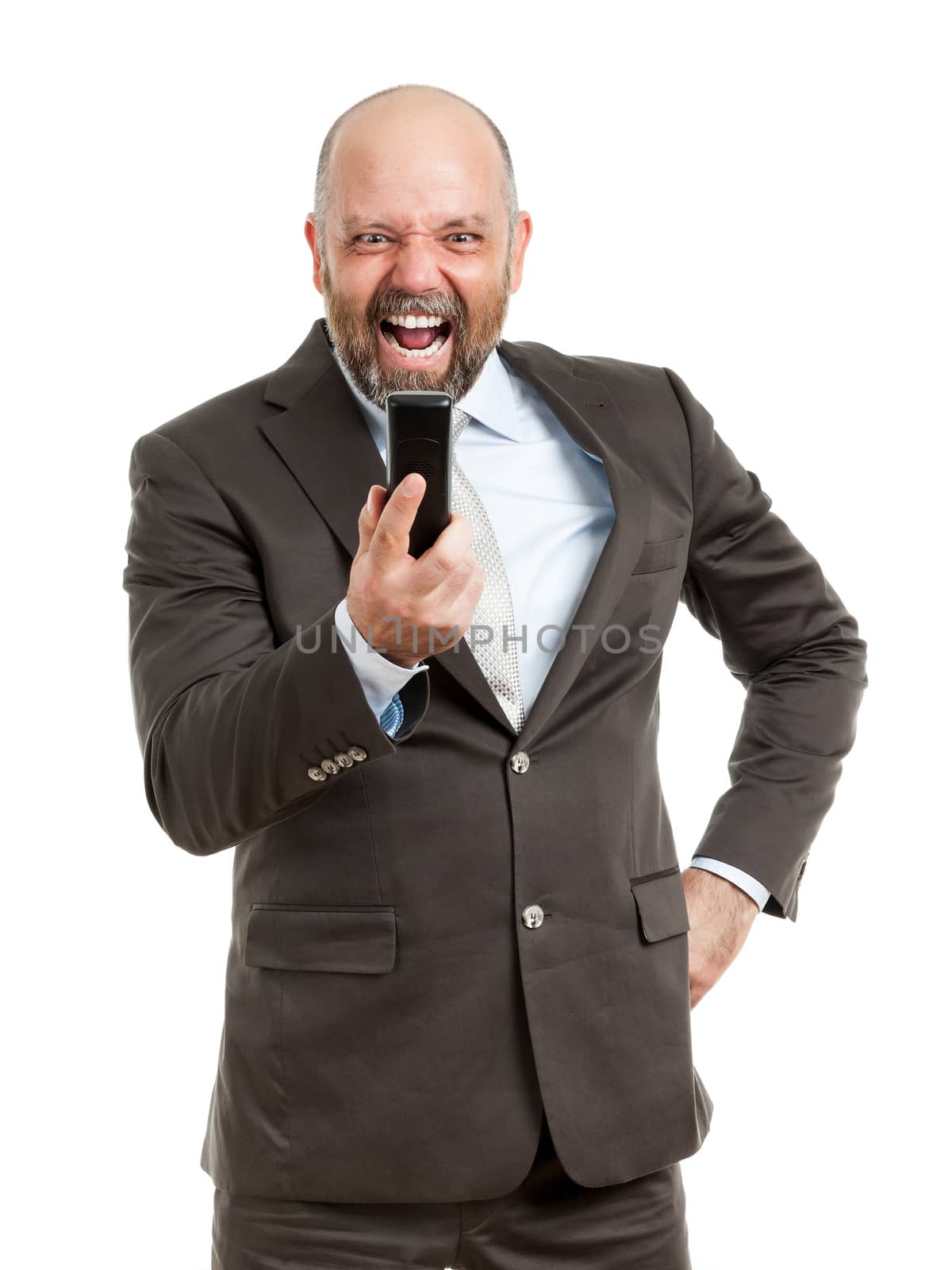 An image of a handsome business man angry at the phone