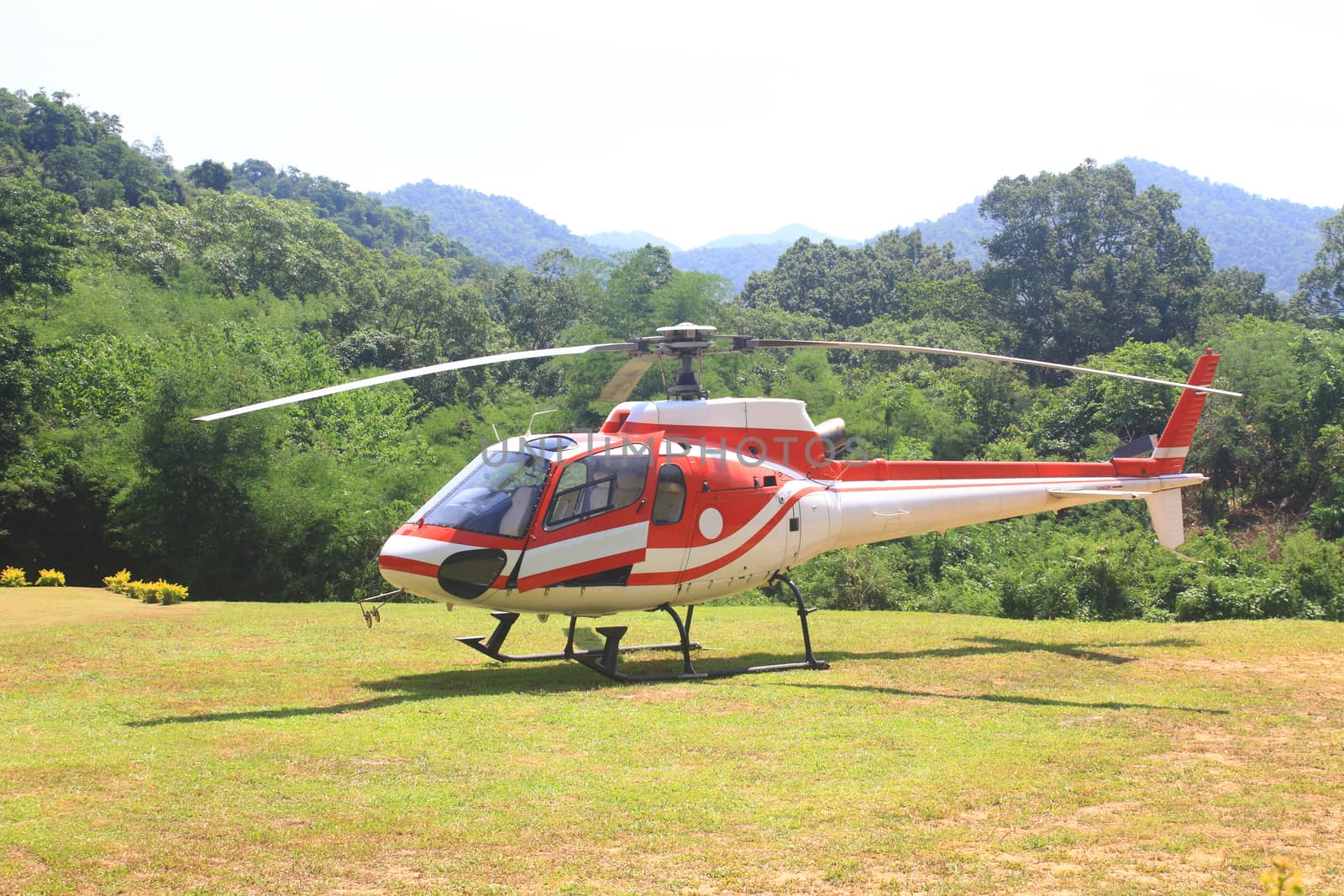 helicopter standing on landing strip in airfield 