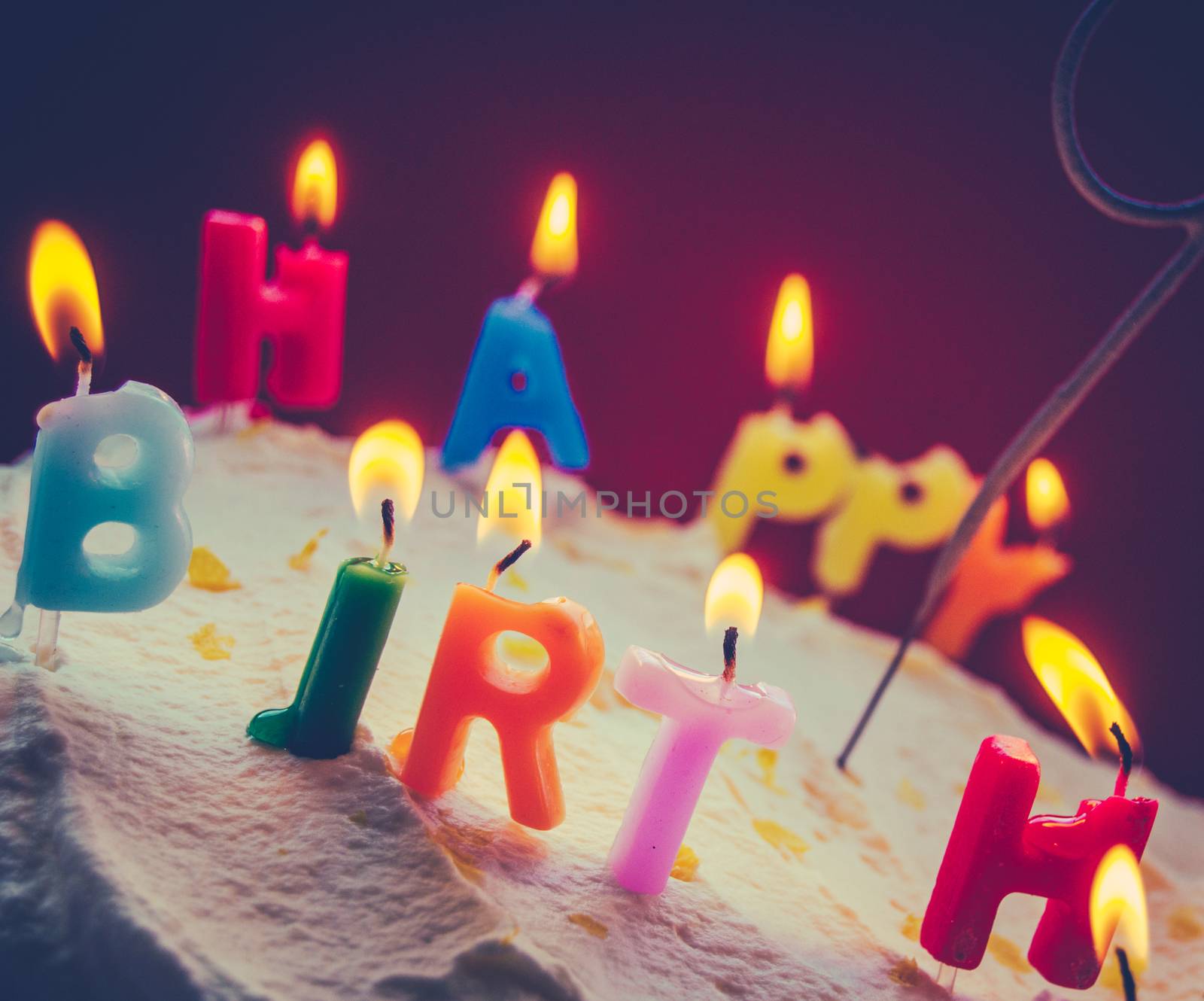 Retro Filtered Photo Of Children's Birthday Candles On A Cream Cake