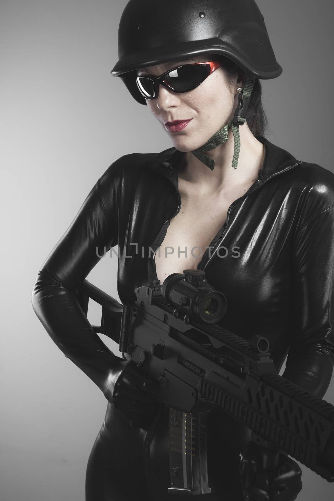 Brunette woman with enormous bulletproof vest and gun by FernandoCortes