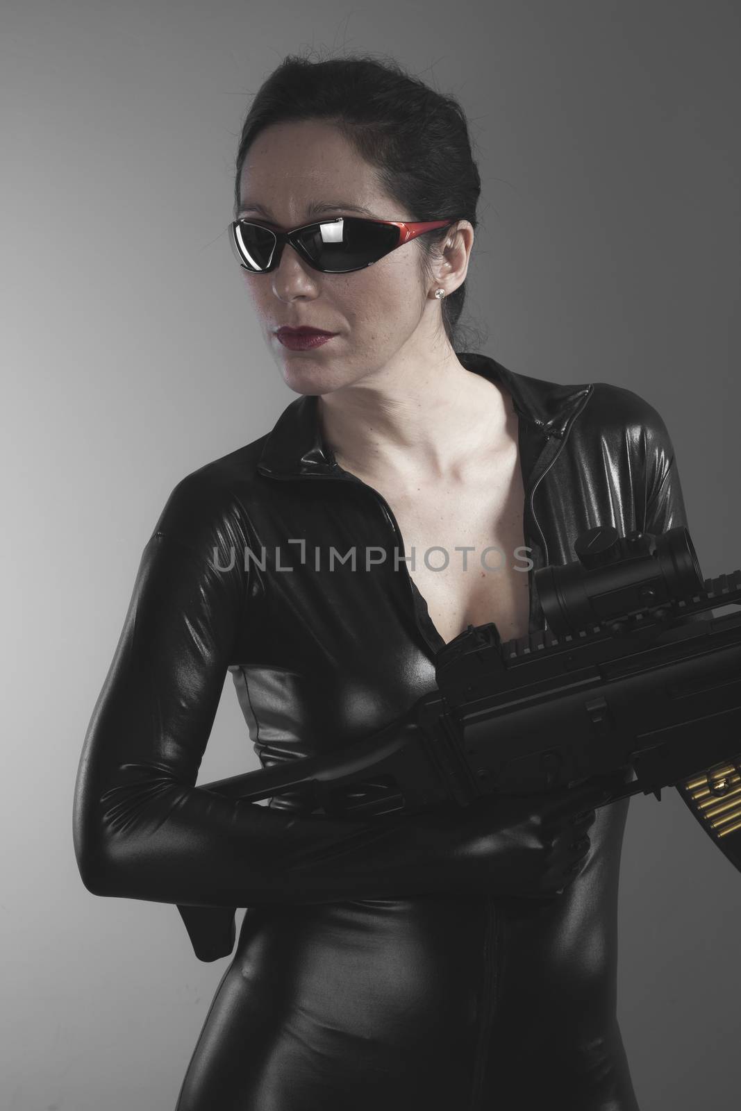 Kill, Brunette woman with enormous bulletproof vest and gun