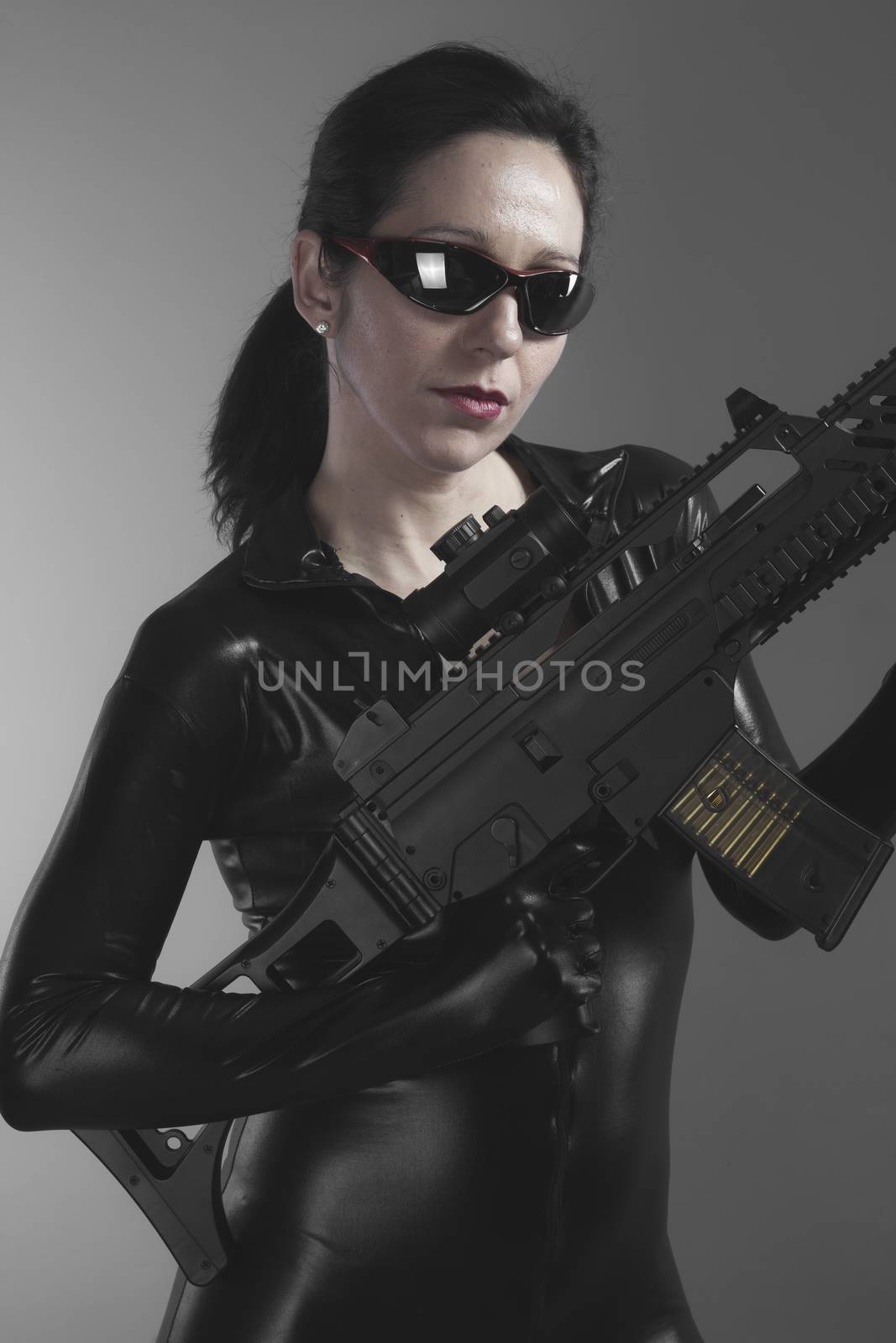 Brunette woman with enormous bulletproof vest and gun by FernandoCortes