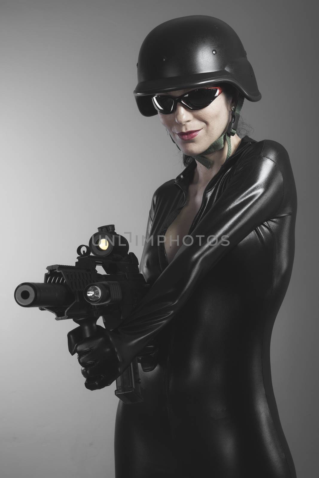Fire, Brunette woman with enormous bulletproof vest and gun by FernandoCortes