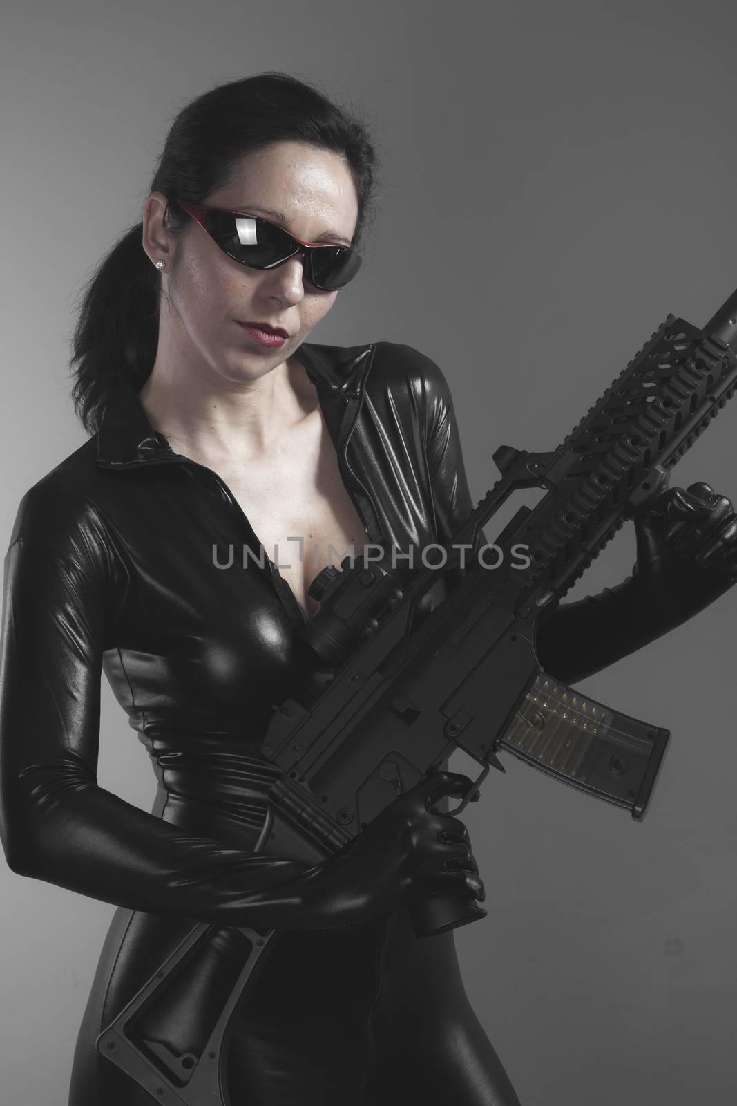 Uzi, Brunette woman with enormous bulletproof vest and gun