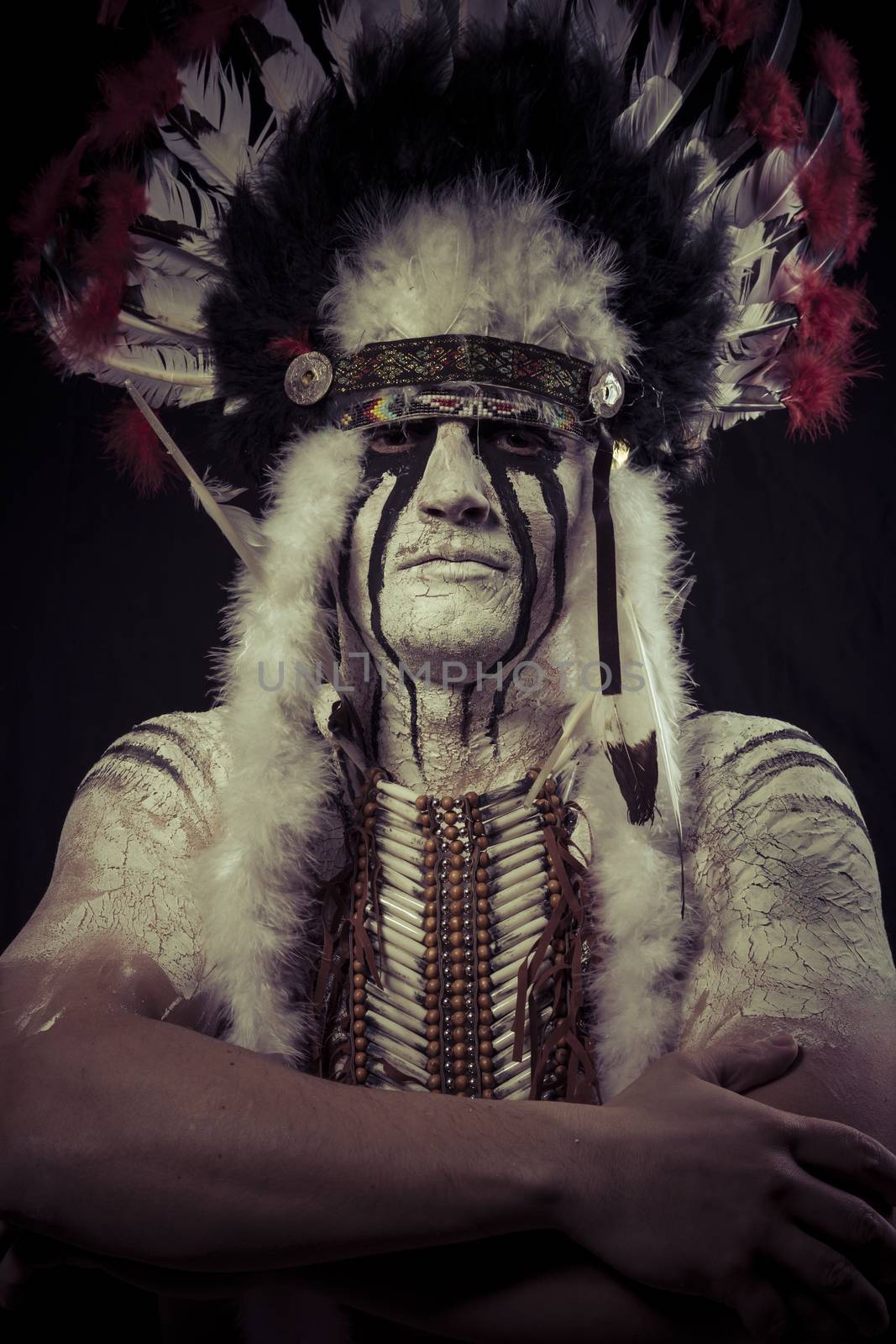 American Indian chief with big feather headdress, warrior