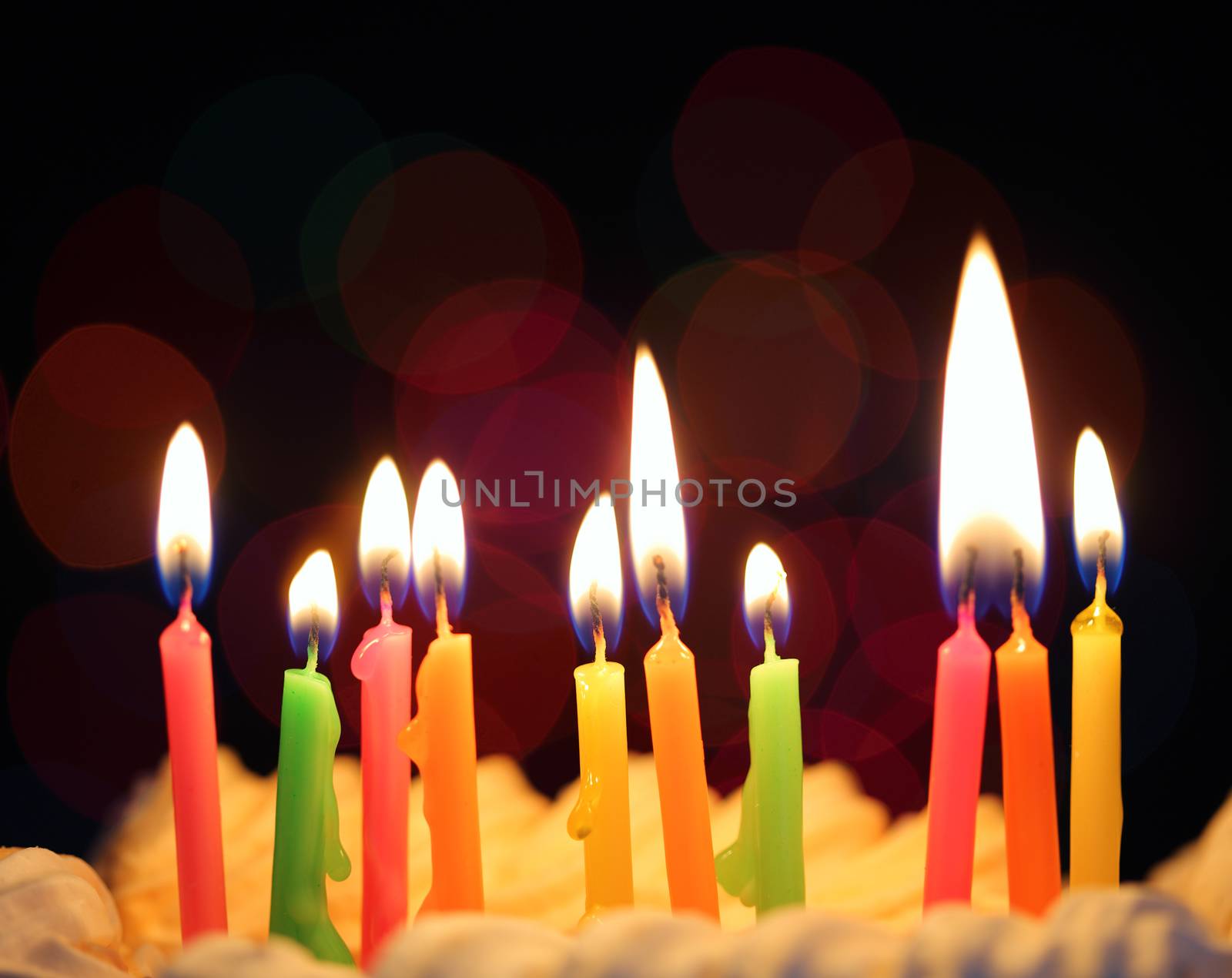 Some lit birthday candles close up 