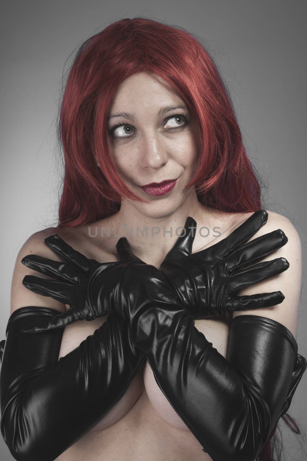 Female, redhead woman with black latex gloves, bare