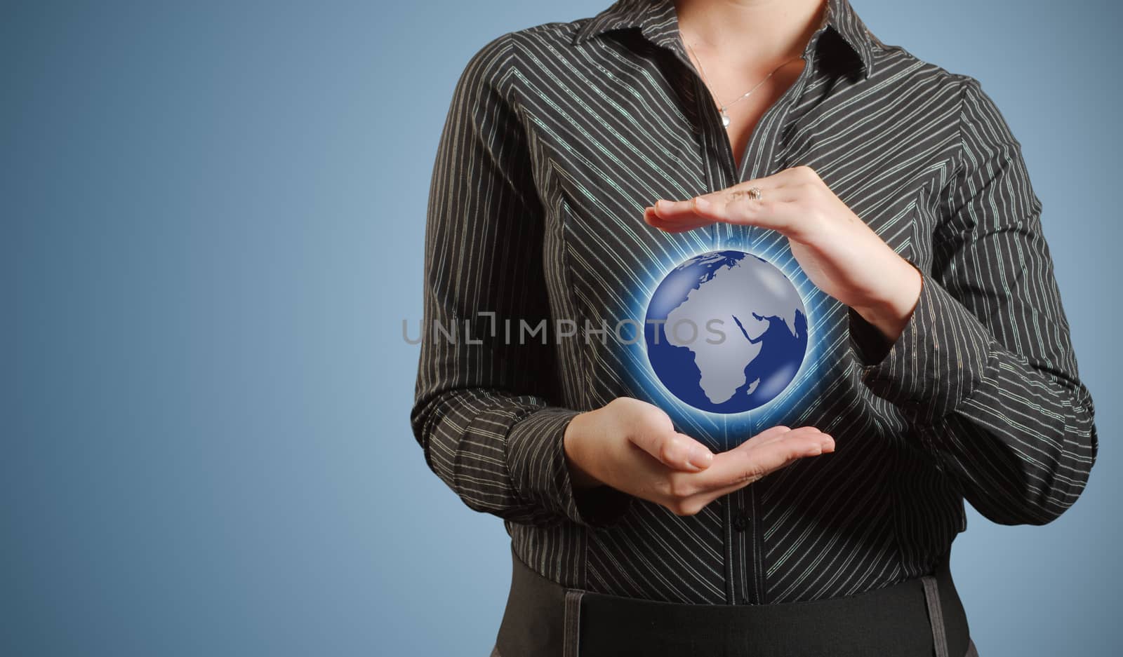 Businesswoman holds or holding world earth in hand by alistaircotton