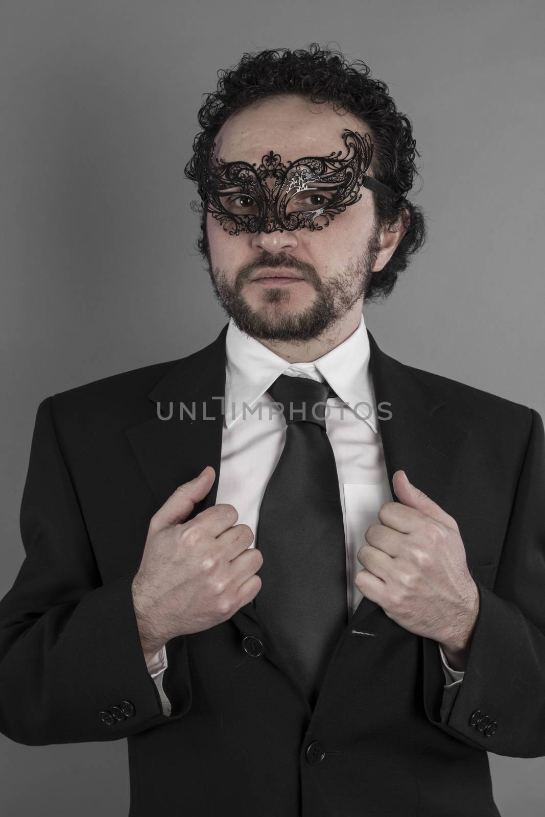 Sexy and mysterious businessman with mask