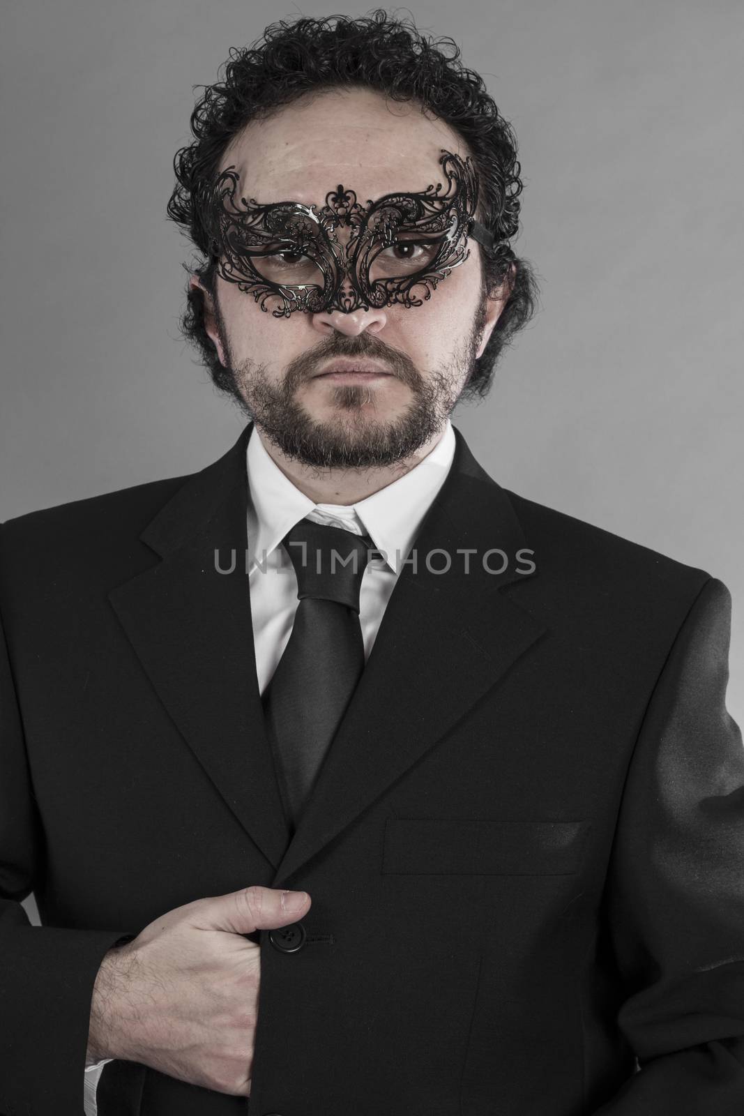 Sexy and mysterious businessman with mask