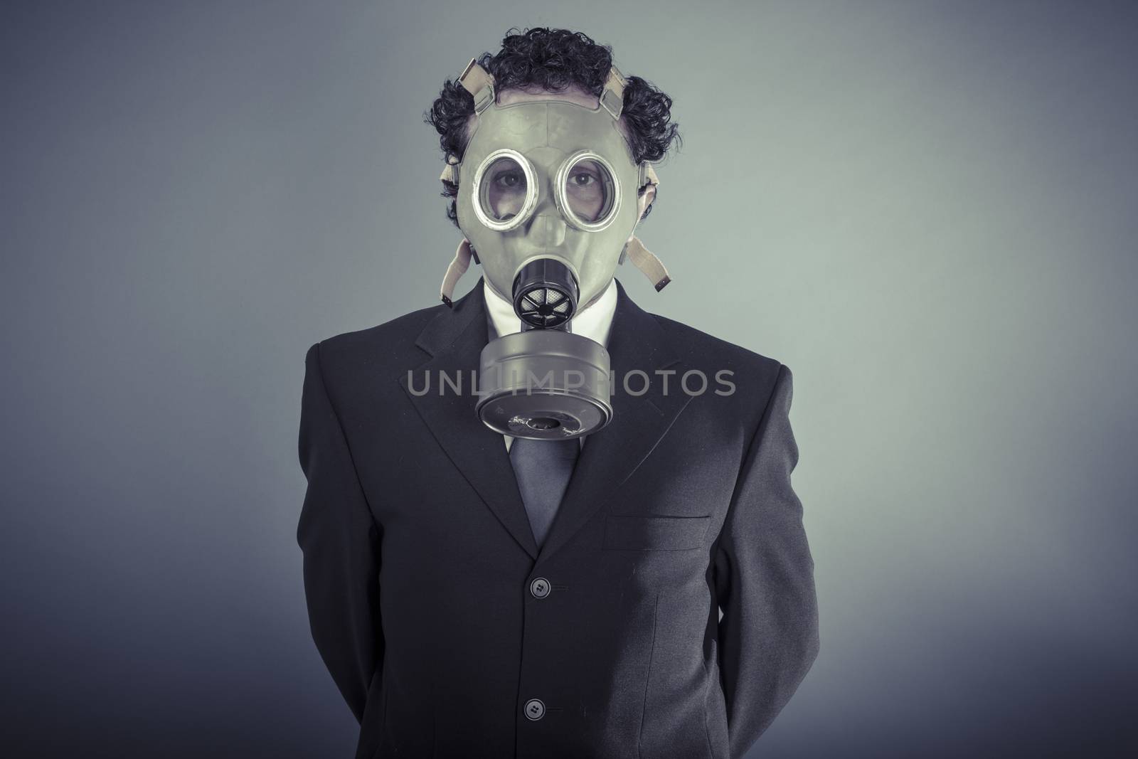 Hazard, Business man wearing a gask mask, pollution concept by FernandoCortes