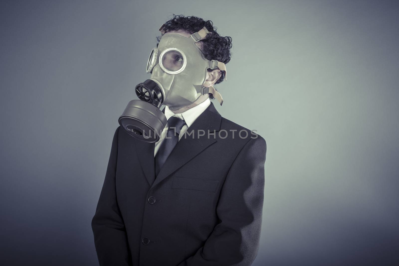 Industry, Business man wearing a gask mask, pollution concept by FernandoCortes