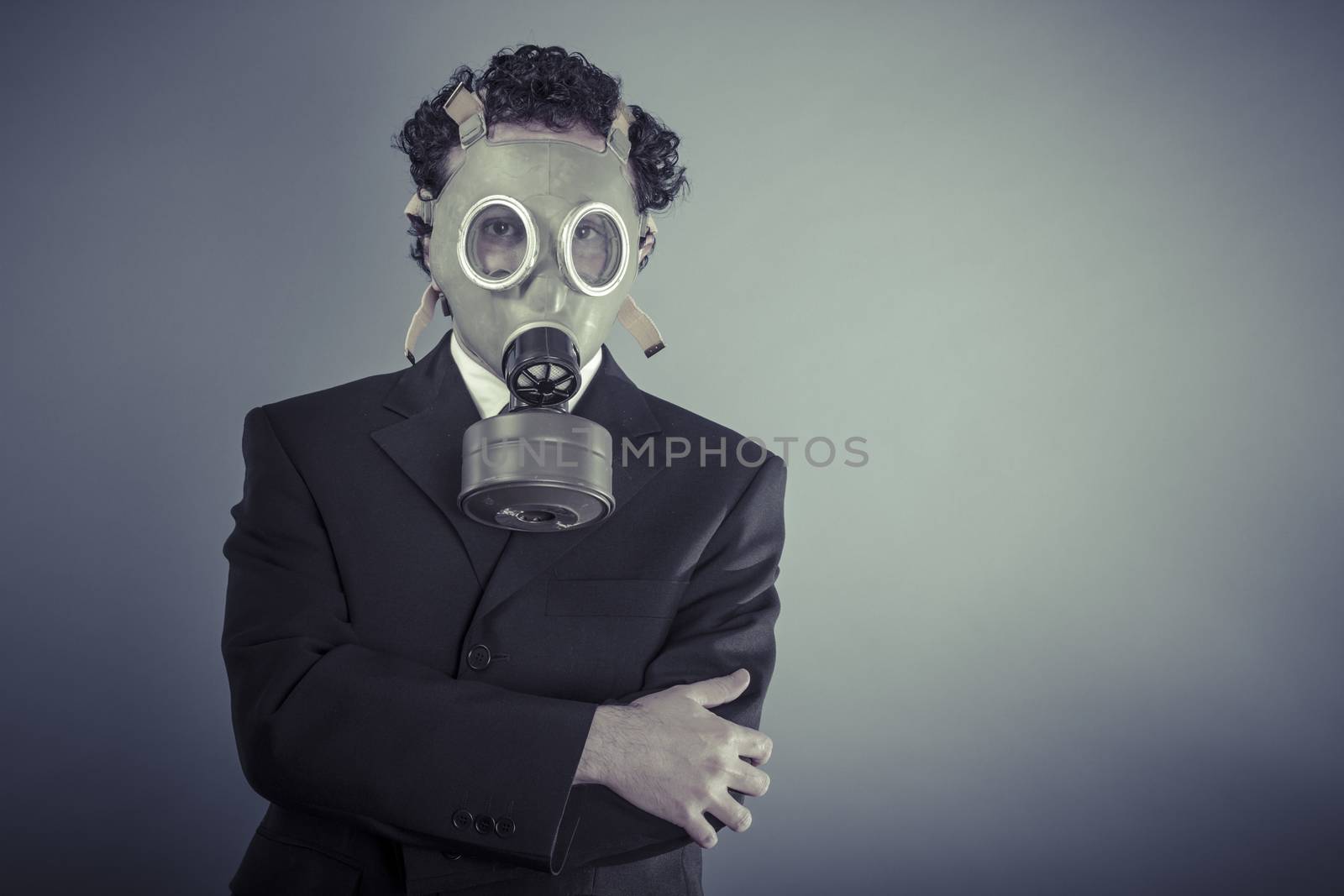 Environment, Business man wearing a gask mask, pollution concept by FernandoCortes