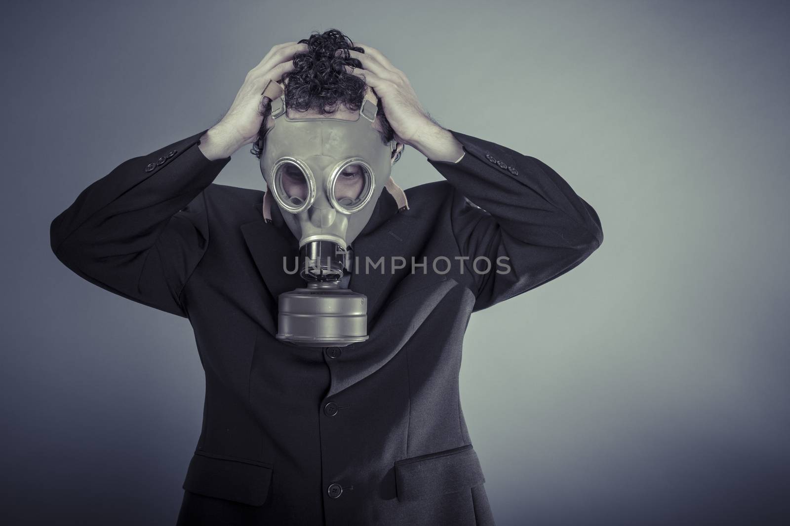 Risk, Business man wearing a gask mask, pollution concept by FernandoCortes