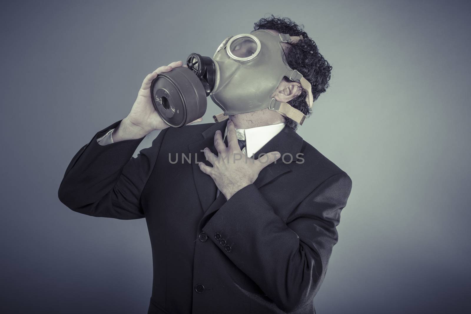 Apocalypse, Business man wearing a gask mask, pollution concept