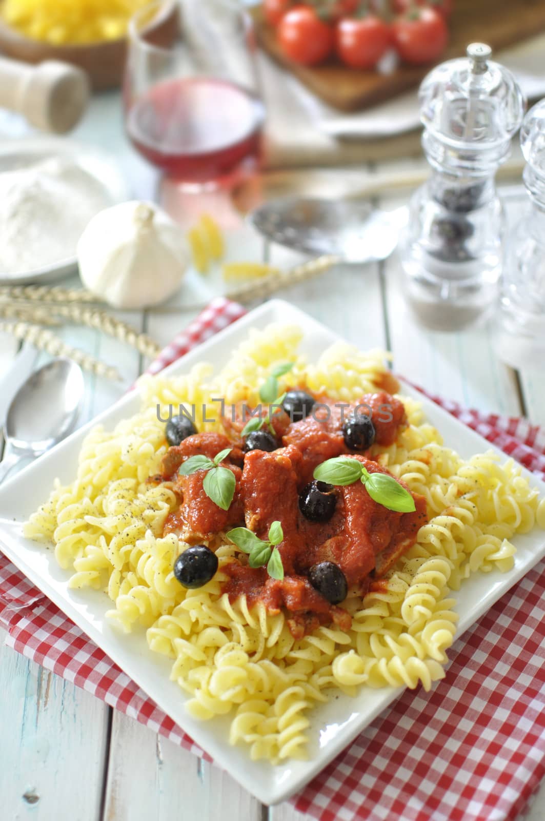 Italian pasta dish with tomato sauce and basil 