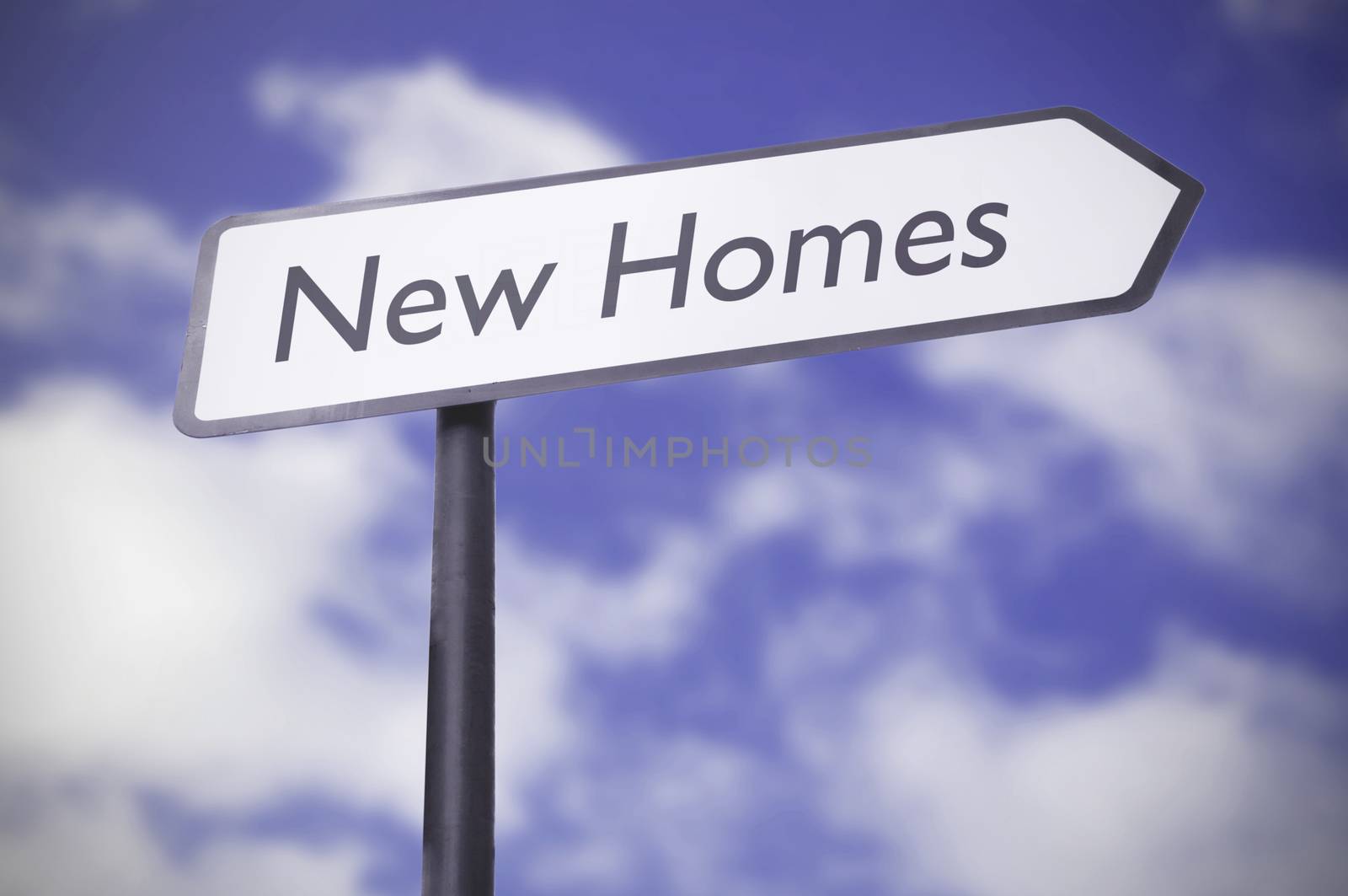 New homes road sign against a blue sky