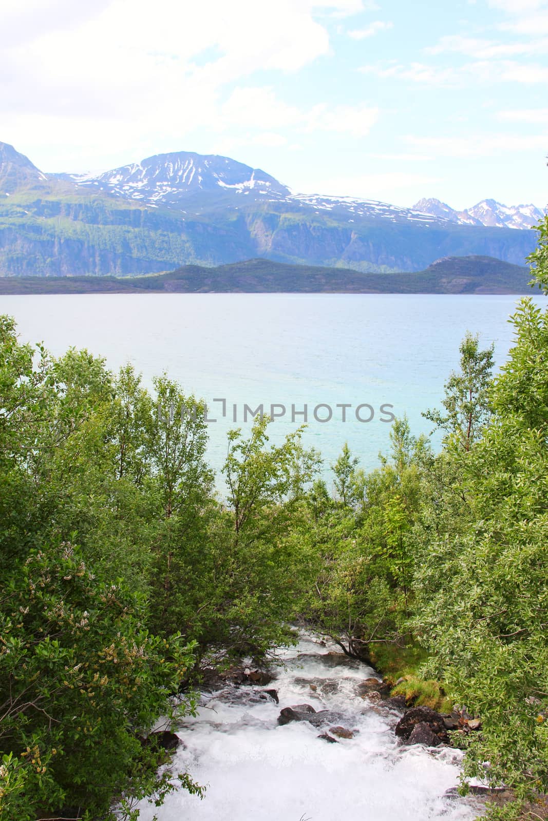 View on mouintain river and fjord in northern Norway