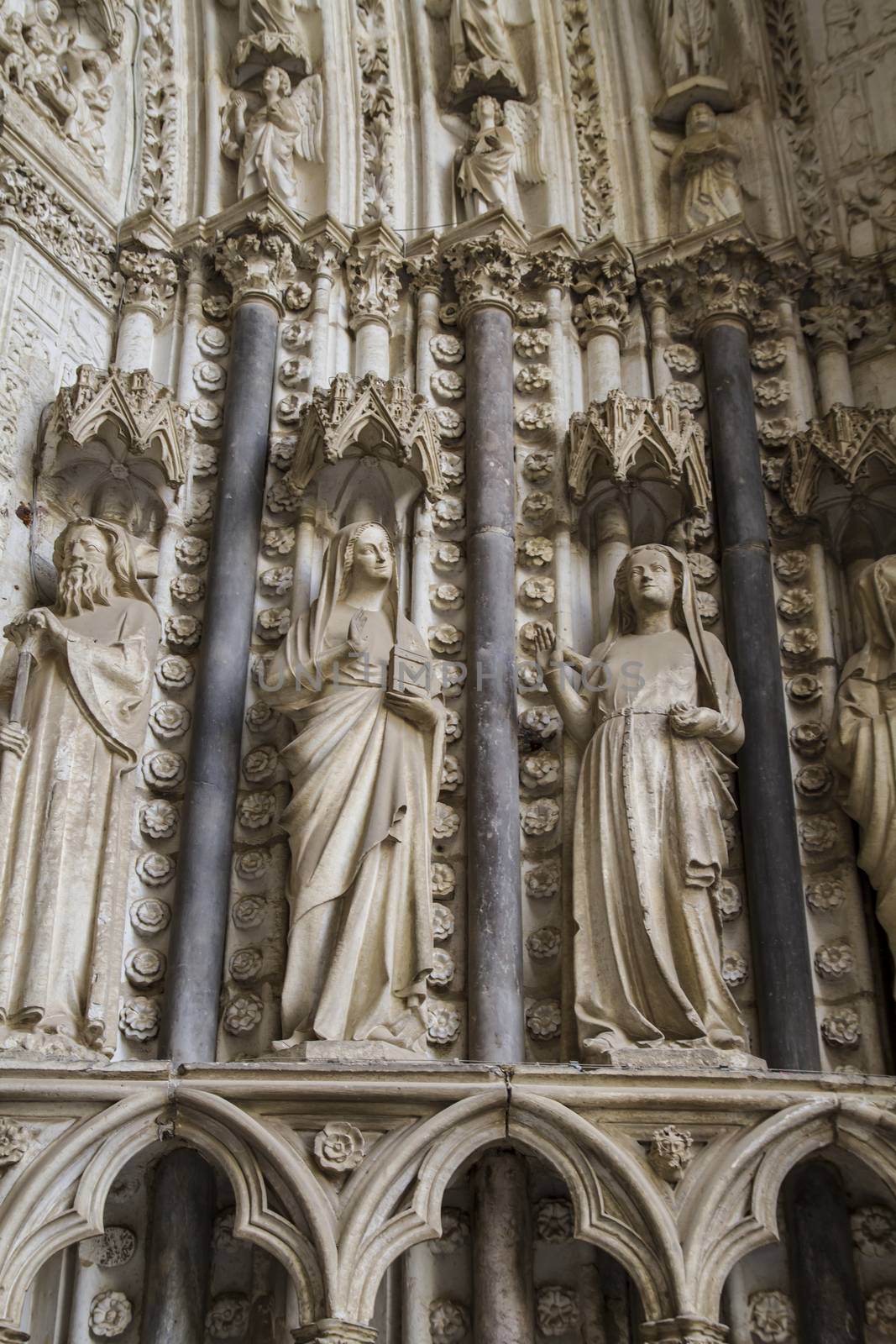 side entrance of the Cathedral of Toledo, arc with religious rel by FernandoCortes