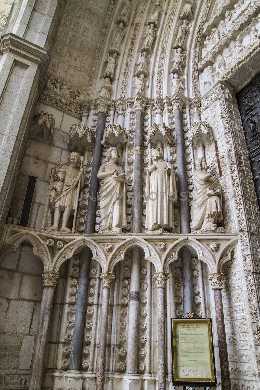side entrance of the Cathedral of Toledo, arc with religious rel by FernandoCortes
