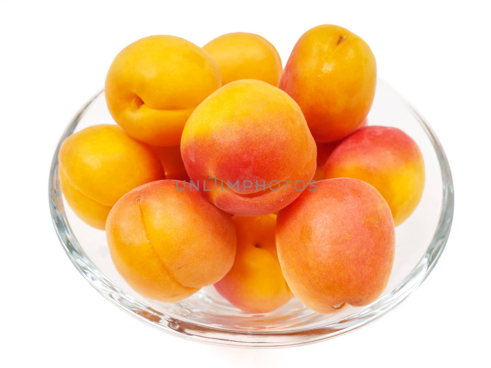 Fresh whole apricot isolated in a glass bowl towards white