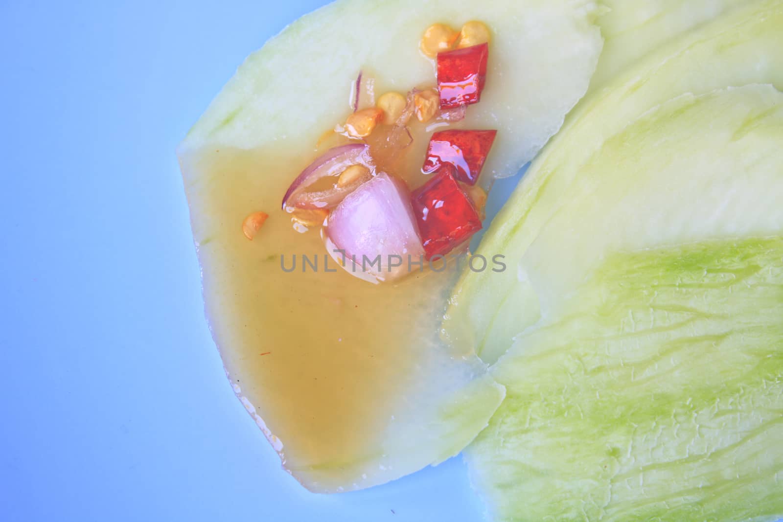 mangoes with sauce, mangoes dipped into a sweet fishy paste with dried shrimp and red onions in plate