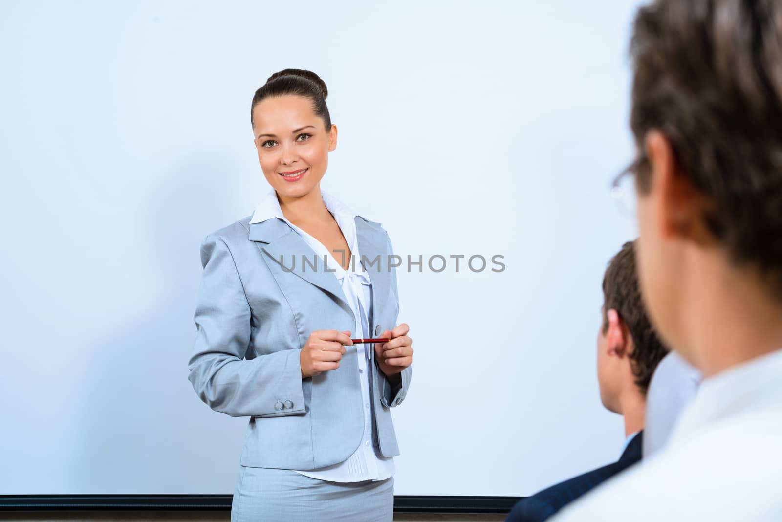 image of a discusses business woman with colleagues