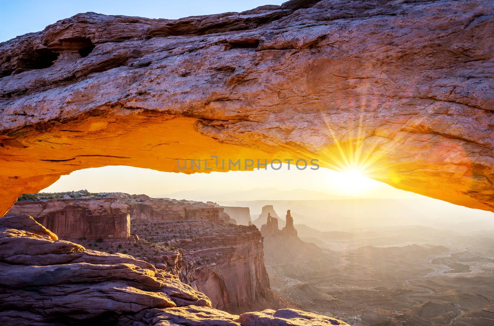 famous Mesa Arch at sunrise, near Moab city, Utah, USA