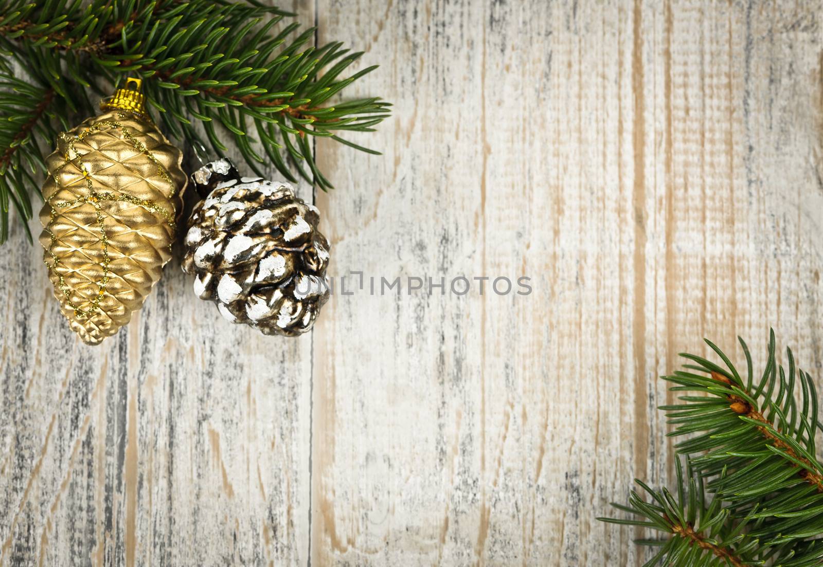 Christmas background with ornaments on branch by elenathewise