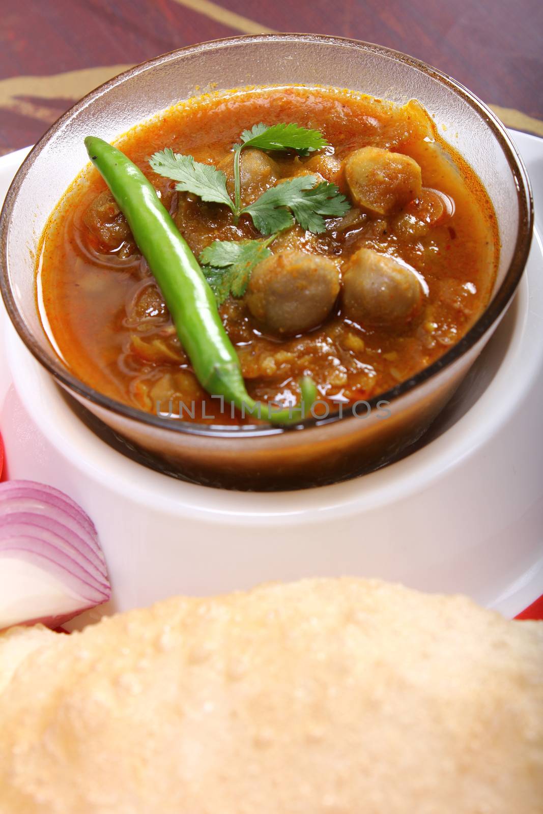 spicy chole bhautre, with green chili topping
indian dish