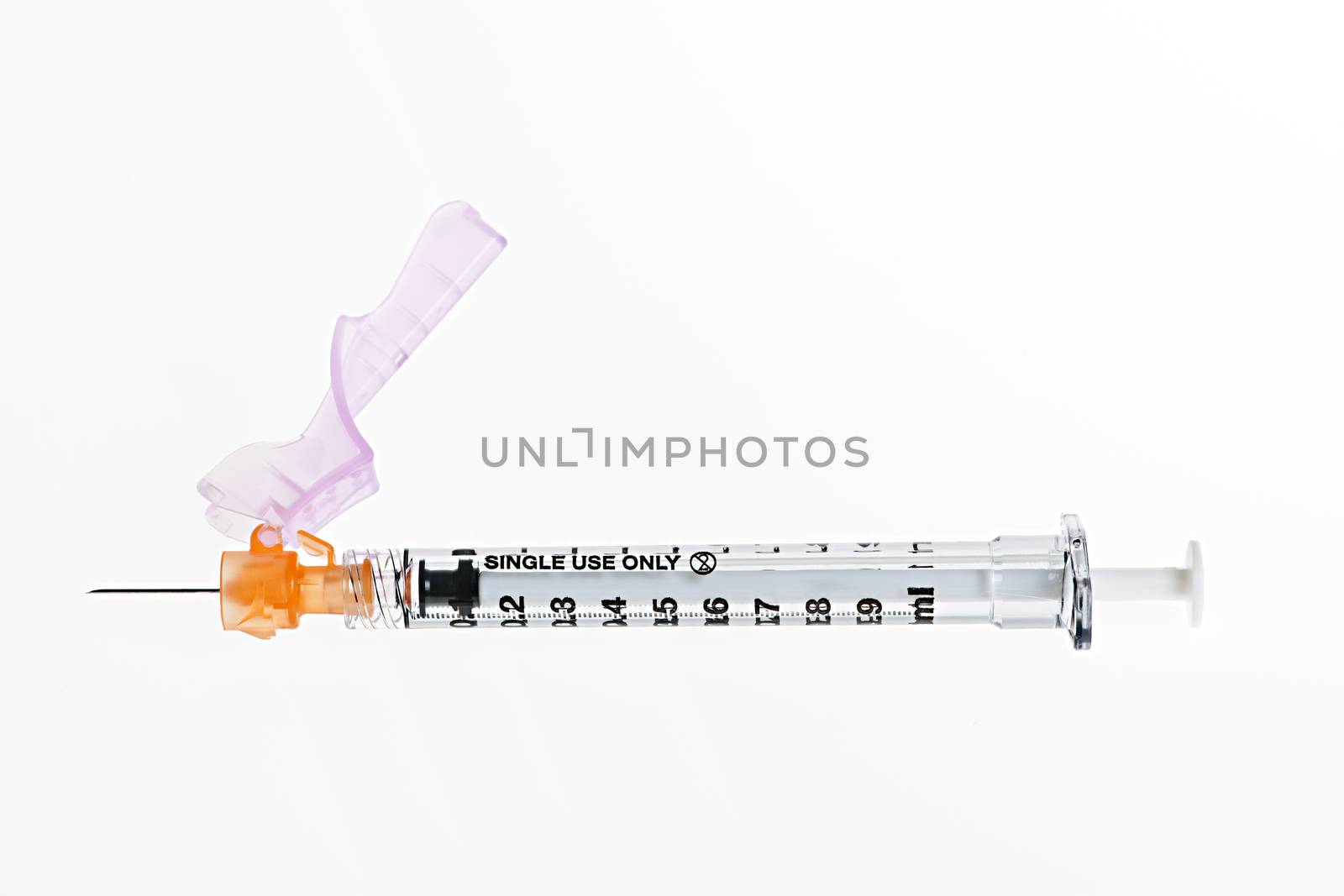 Medical single use safety syringe isolated on white background