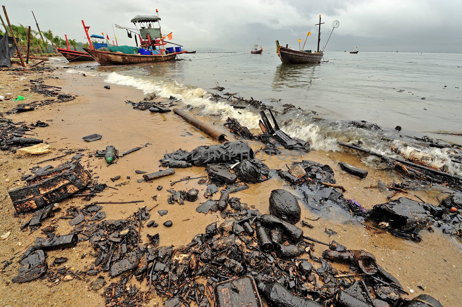 oil polution on the beach, Thailand by think4photop