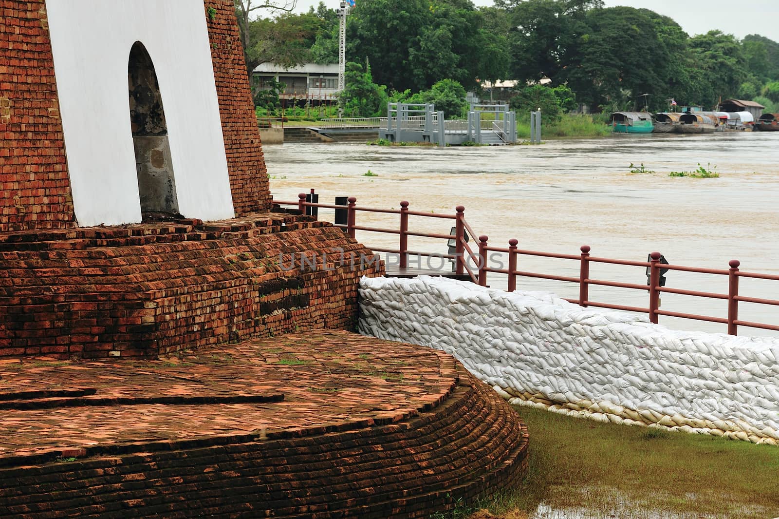 sandbags to protect ancient ruins in Ayuttaya, Thailand during t by think4photop