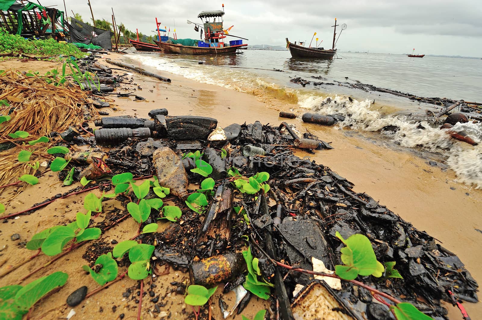 Oil spill. Contaminated Beach in Chonburi, Thailand.