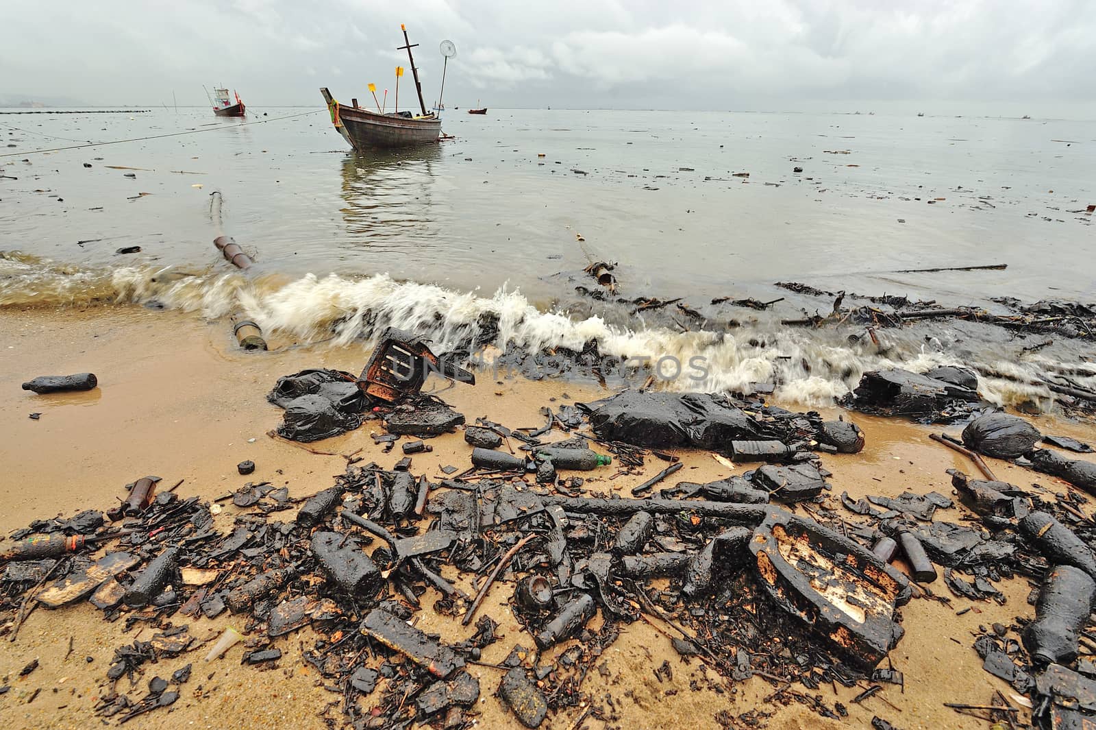 oil polution on the beach, Thailand by think4photop