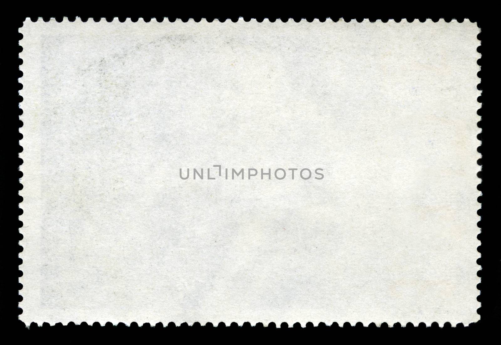 A blank postage stamp isolated on a black background.