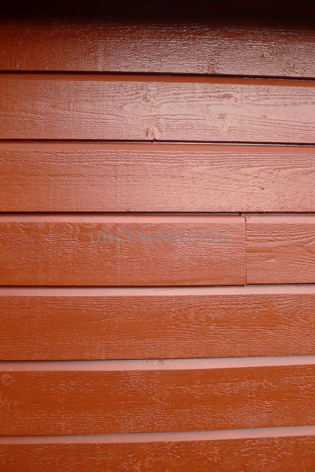 Red painted wooden house wall