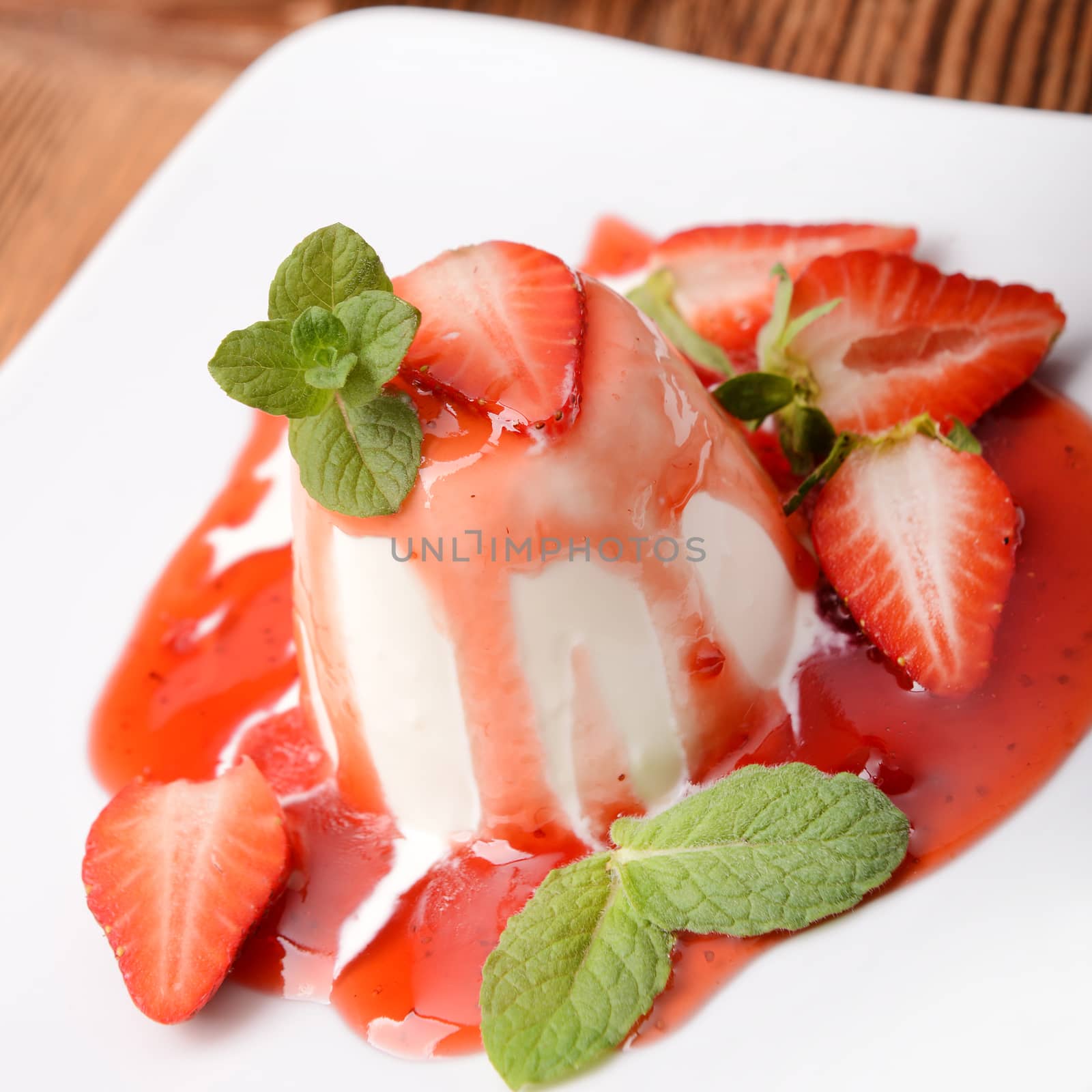 Italian dessert panna cotta with fresh strawberries