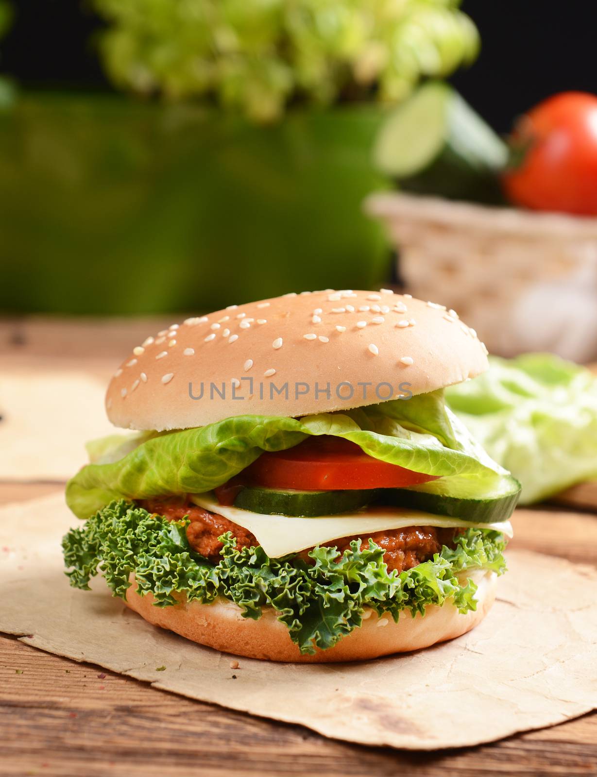 Homemade hamburgers with cheese, tomatoes and cucumbers