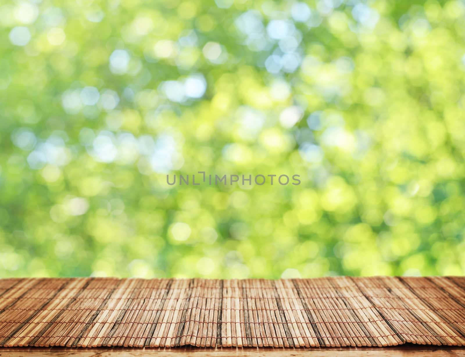 Empty table and defocused fresh green background