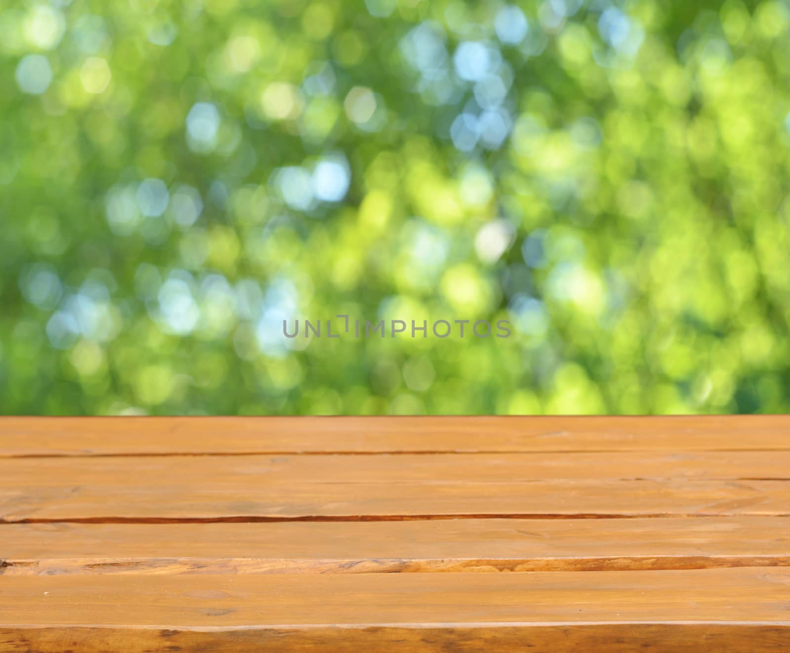 Empty table and defocused fresh green background