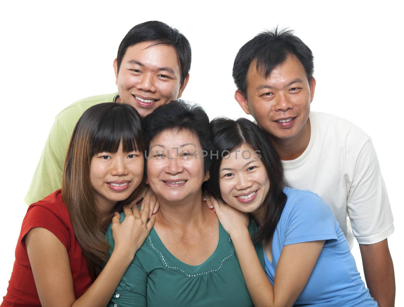 Asian family portrait. Happy senior mother and her adult offsprings, smiling isolated on white background.